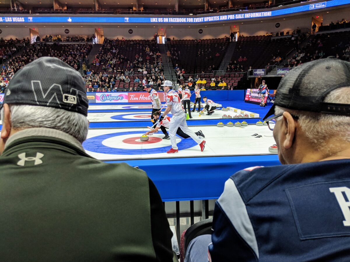 Curling fans watch John Landsteiner of Team Shuster deliver a curling stone as part of Team North America at the 2019 Continental Cup at the Orleans Arena in Las Vegas, Nev., on Jan. 20, 2019. (Ryan Olson, Standard-Examiner)
